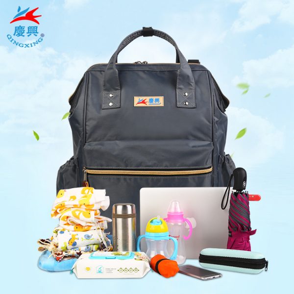 Hot selling in Amazon 900D waterproof polyester top quality diaper bag with changing pad