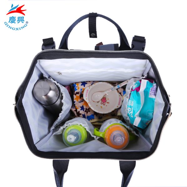 Hot selling in Amazon 900D waterproof polyester top quality diaper bag with changing pad