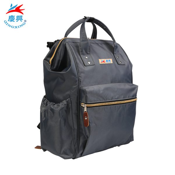 Hot selling in Amazon 900D waterproof polyester top quality diaper bag with changing pad